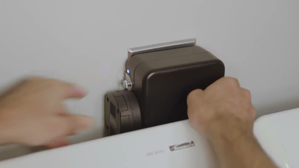 The Smart Splitter mounted on the wall above a dryer
